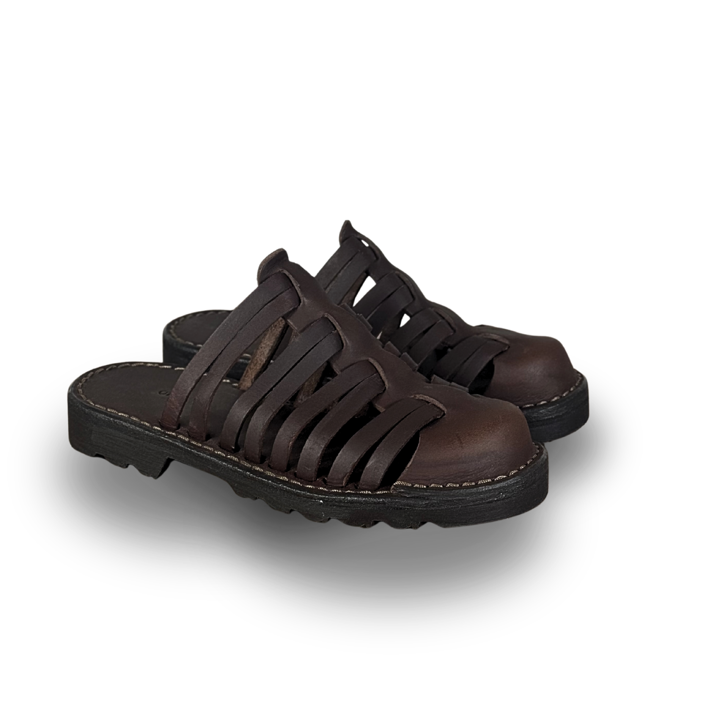 A detailed product shot of Debrovka handmade luxury leather sandals in rich brown, featuring a classic woven design, sturdy buckle, and durable sole. This image highlights the superior craftsmanship, quality materials, and timeless style that define Debrovka’s premium leather goods and artisanal sandals for men, women, and unisex.